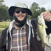 Josh holding a fish, Riverside client testimonial