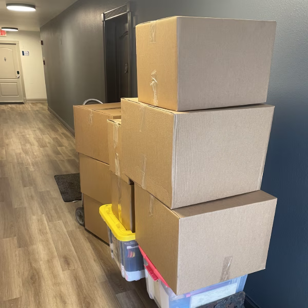 Orange County moving services boxes packed and moved with a dolly