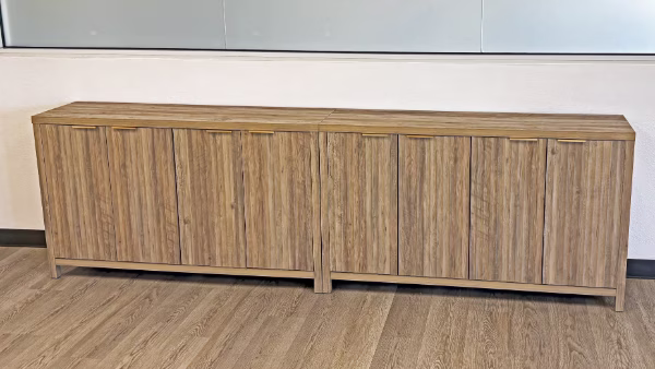 Office credenza installation under glass board in Orange County—COI-ready commercial installers.