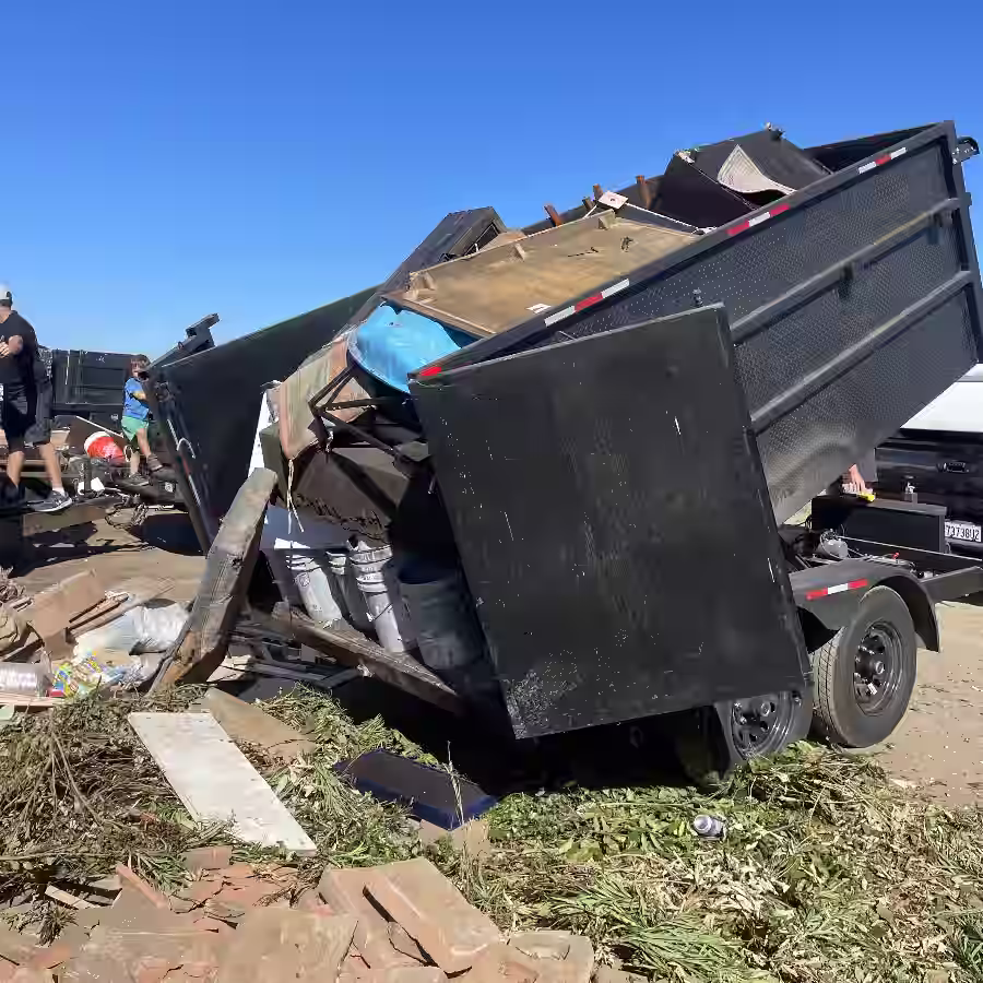 Trailer loaded during a Costa Mesa junk removal cleanout job with bulky furniture, debris, and yard waste.